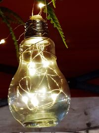 Close-up of illuminated light bulb