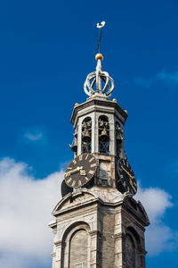 Low angle view of clock tower against sky