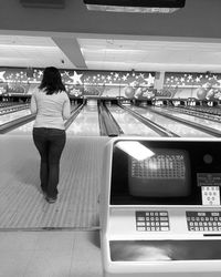 Rear view of woman looking at camera