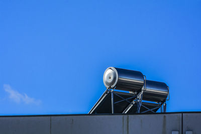 Metallic structure against blue sky