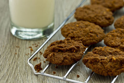 Close-up of milk with cookies on table