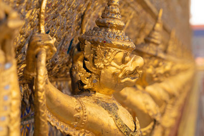 Close-up of statue against temple outside building