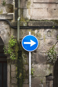 Road sign on wall