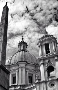 Low angle view of church against cloudy sky