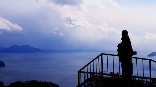 Scenic view of sea against cloudy sky