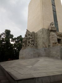 Statue of historic building against sky