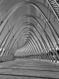 Full frame shot of metal tunnel with shadows in black and white