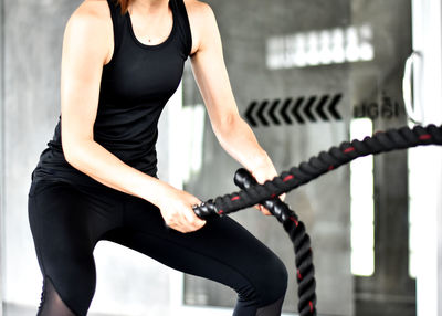 Midsection of woman with bicycle