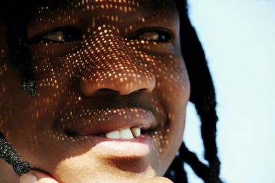 Close-up portrait of a smiling young woman