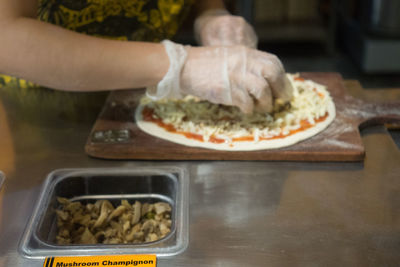 Close-up of woman preparing food