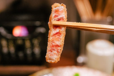 Cropped hand of woman holding knife
