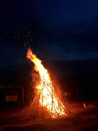 View of bonfire at night