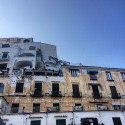 Low angle view of building against blue sky