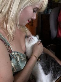 Midsection of woman with arms raised