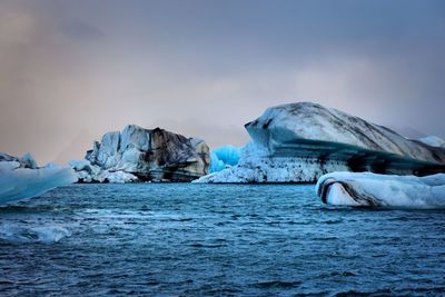 Scenic view of frozen landscape against sky