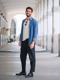 Portrait of young man standing outdoors