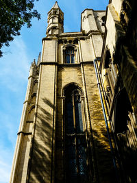 Low angle view of bell tower against sky