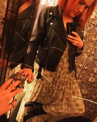 Woman photographing with mobile phone