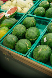 High angle view of watermelons in market for sale