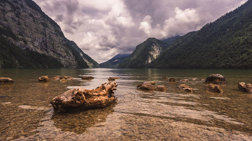 Scenic view of lake and mountains against sky