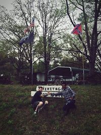 Men in front of trees