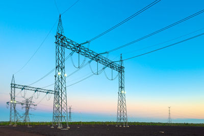 Electric substation and pwer lines in paraguay at dawn.