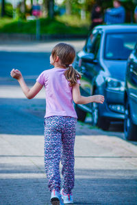 Rear view of girl on street