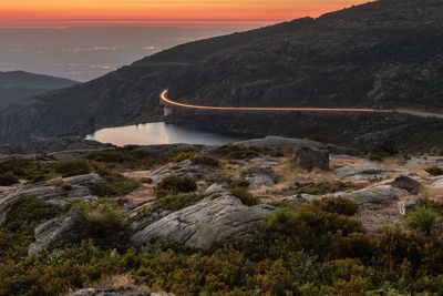 Scenic view of mountains against sky during sunset