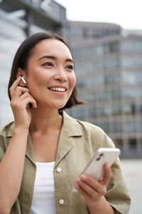 Young woman using mobile phone