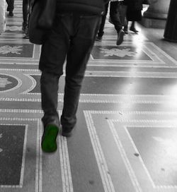 Woman walking on road in city