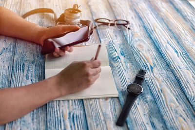 High angle view of woman working on table