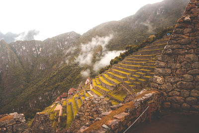 Panoramic view of land and mountains against sky