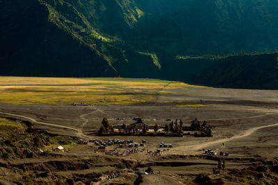 Scenic view of agricultural landscape against mountain