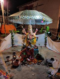 Illuminated lanterns outside building