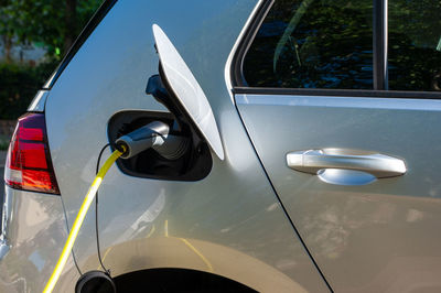 Close-up of white car on side-view mirror