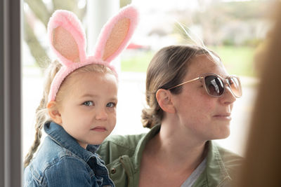 Close-up of girl wearing costume rabbit ears