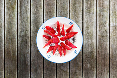 High angle view of red fruit on table