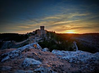 Scenic view of landscape against sky at sunset