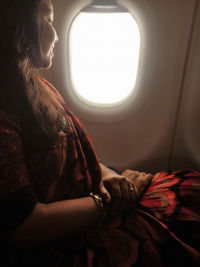 Woman sitting in airplane