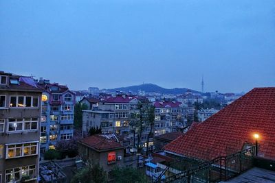 High angle view of buildings against clear sky