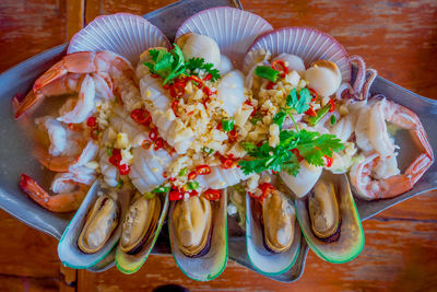 High angle view of vegetables in plate on table