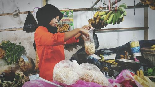 People for sale at market stall