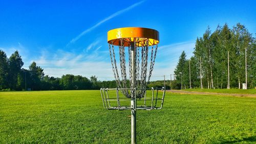 Scenic view of grassy field against cloudy sky
