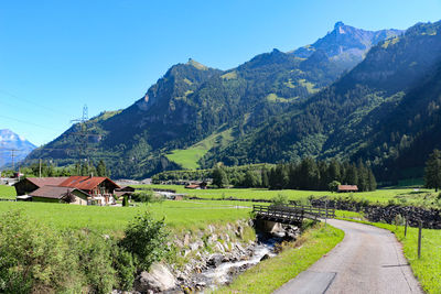 Scenic view of landscape and mountains against sky