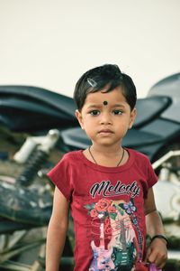 Portrait of boy standing outdoors