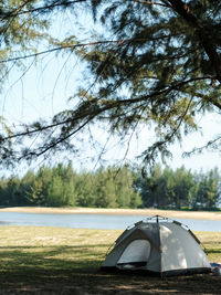 Tent on field against sky