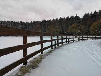 Scenic view of frozen lake against sky during winter