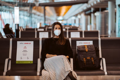 Portrait of woman sitting on seat