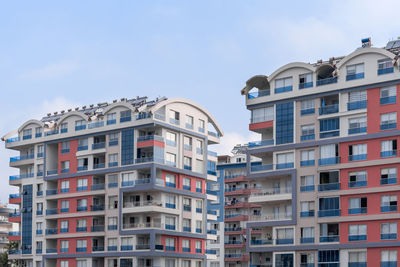 Colorful residential complex of several houses against the sky.