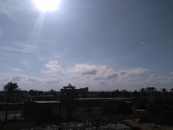 Scenic view of field against sky on sunny day